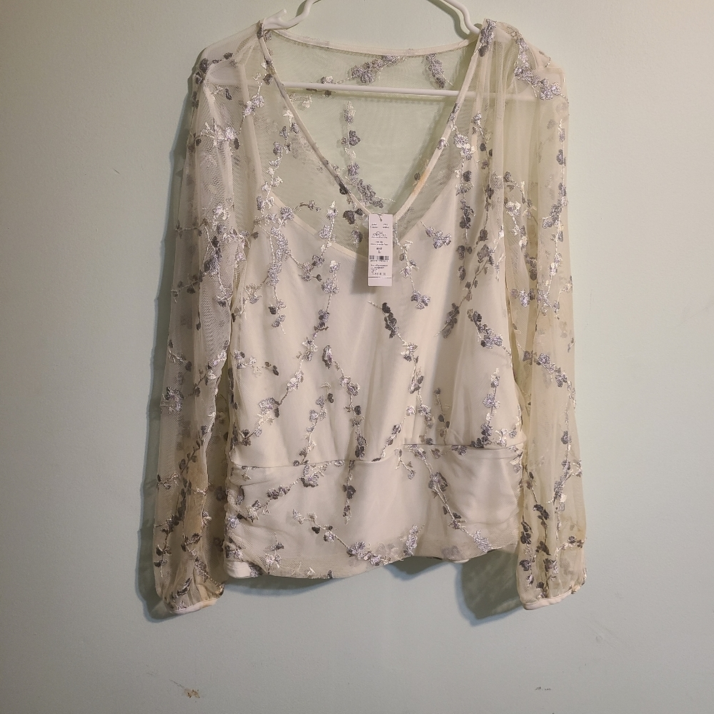 Mesh shirt with embroidery, tank underneath.